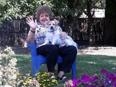 Shirley sitting with Dog